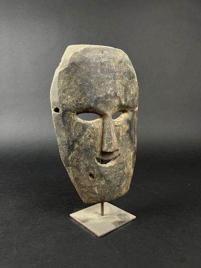 Rectangular shamanic mask with human face....