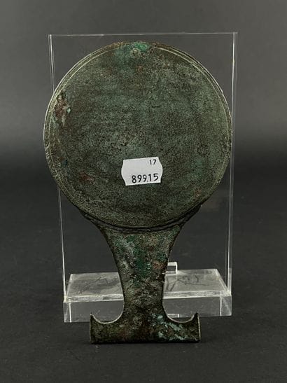 Circular mirror with twisted handle. Bronze,...