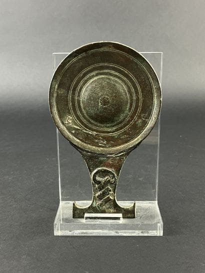 Circular mirror with twisted handle. Bronze,...