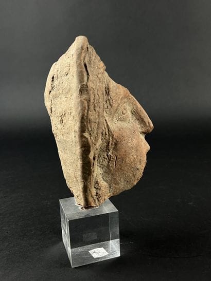 Fragmentary votive head. Terracotta, visible...