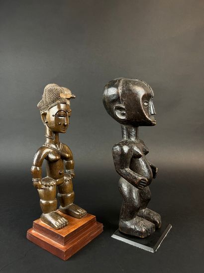 Two standing statuettes, one from Côte d'Ivoire,...