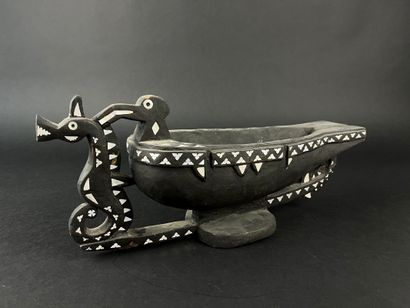 Blackened wood bowl representing a frigate...