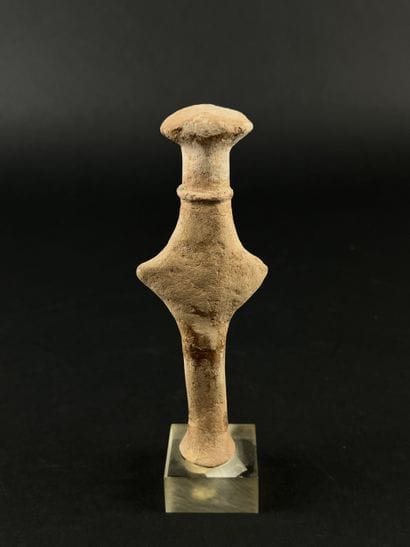 Anthropomorphic idol wearing a necklace....
