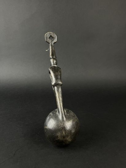 Ladle. The handle is decorated with a seated...