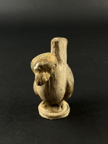 Statuette representing a stylized bird. Terracotta,...