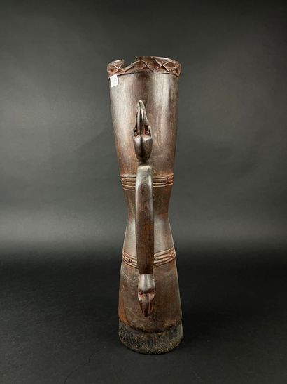 Hourglass drum, decorated with two human...