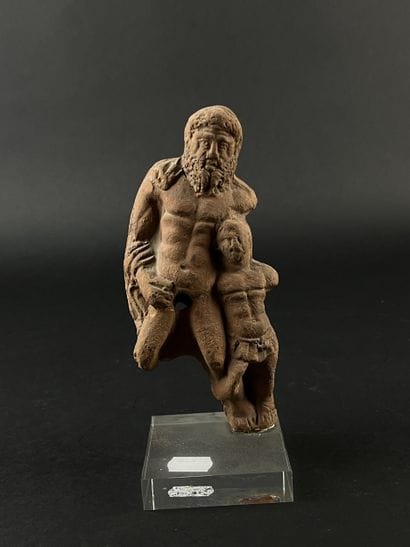 Statuette representing a bearded figure and...