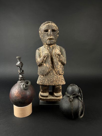 Lot of three objects: a statue of a figure...