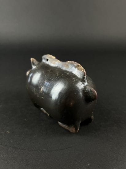 Plastic vase in the shape of a boar. Black...