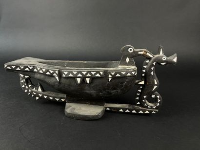 Blackened wood bowl representing a frigate...