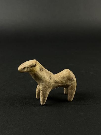 Statuette representing a stylized horse....