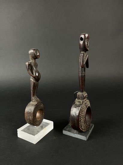 Two ghurra, churn elements. Depicting two...