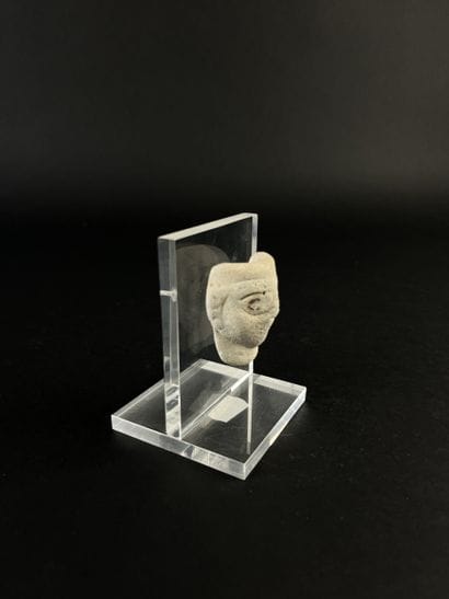 Small anthropomorphic mask, eyes painted...