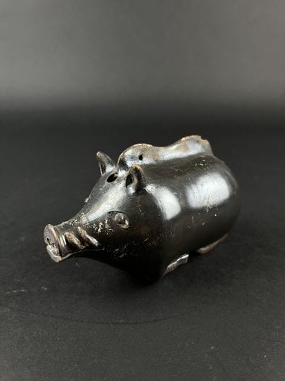 Plastic vase in the shape of a boar. Black...