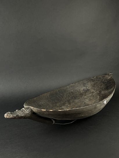 Large wooden bowl decorated at the ends with...