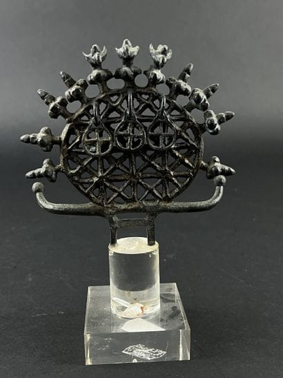 Ornament in the form of an openwork disk...