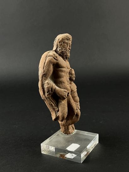 Statuette representing a bearded figure and...