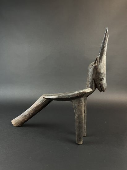 Tripod seat representing an antelope. Wood...