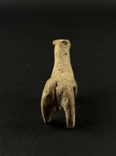 Statuette representing a stylized horse....