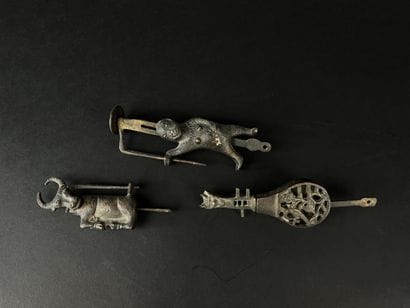 Lot of three bronze padlocks depicting a...