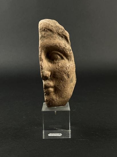 Fragmentary anthropomorphic votive head....