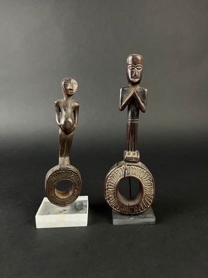 Two ghurra, churn elements. Depicting two...