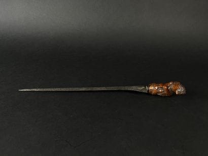 Kriss, the damascened blade depicts the snake...