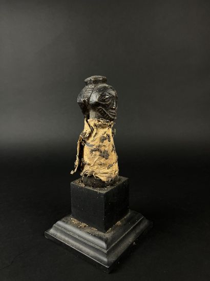 Janus pestle fetish, wooden body covered...