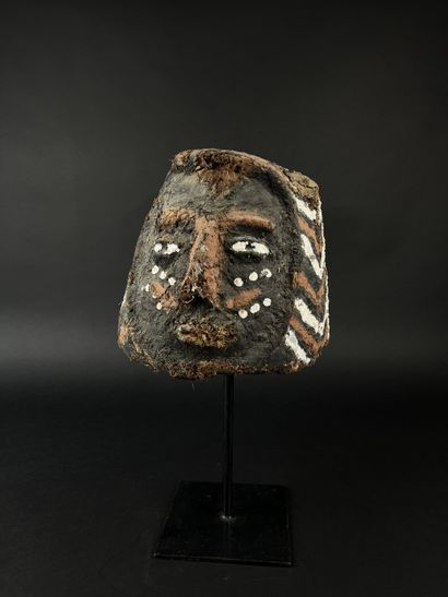 Janus helmet mask, depicting two human heads....