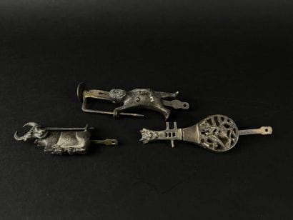 Lot of three bronze padlocks depicting a...