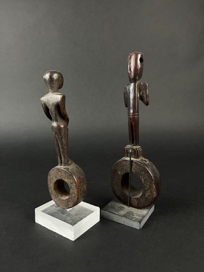 Two ghurra, churn elements. Depicting two...