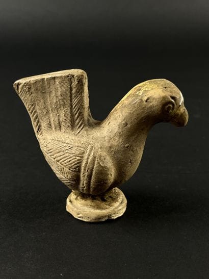 Statuette representing a stylized bird. Terracotta,...