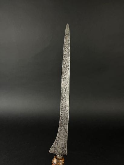 Kriss, the damascened blade depicts the snake...