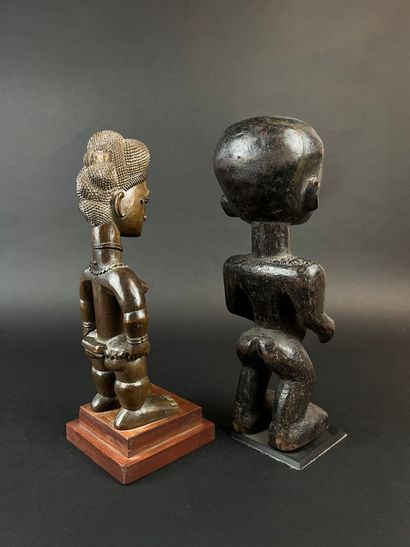Two standing statuettes, one from Côte d'Ivoire,...