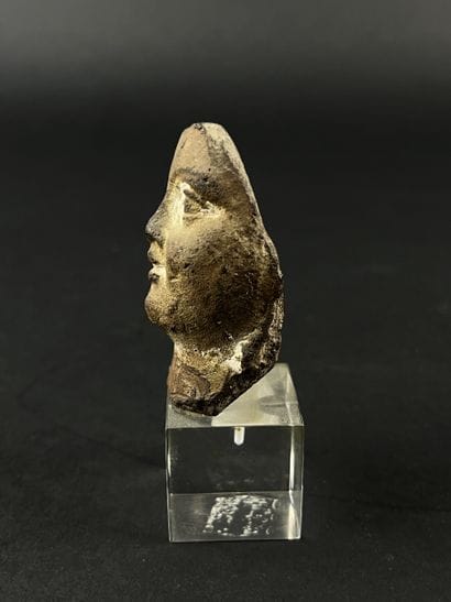 Head from a statuette. Terracotta, visible...