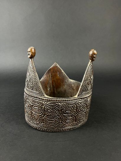 Crown adorned with geometric motifs, the...