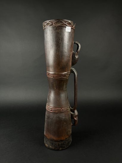 Hourglass drum, decorated with two human...