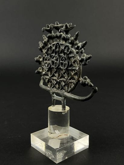 Ornament in the form of an openwork disk...