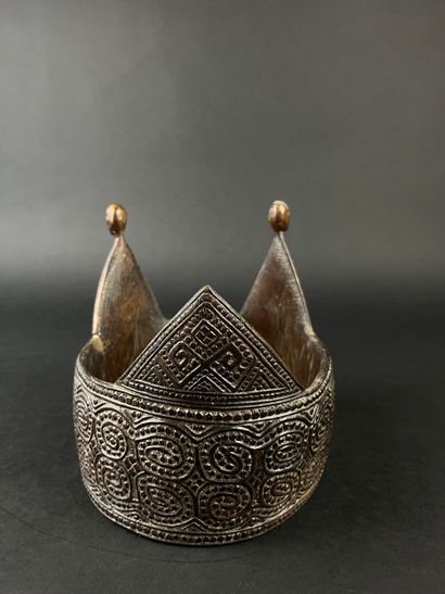 Crown adorned with geometric motifs, the...