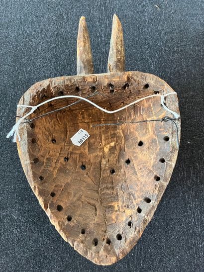 Facial mask. The heart-shaped face is surmounted...