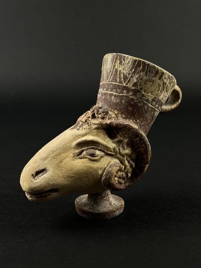 Lot consisting of a zoomorphic askos, a ram-head...