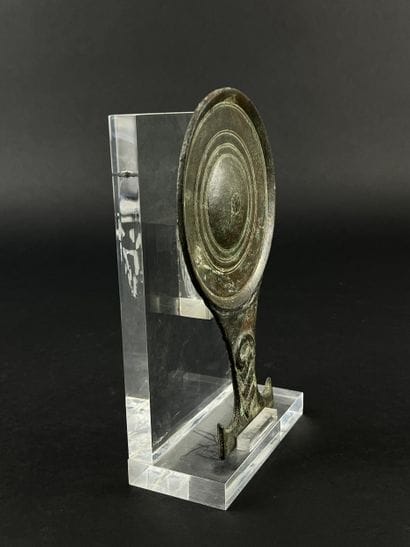 Circular mirror with twisted handle. Bronze,...