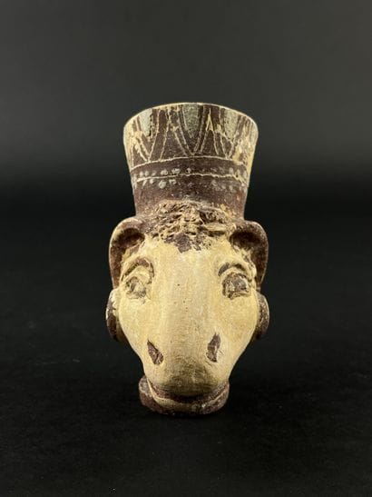 Lot consisting of a zoomorphic askos, a ram-head...
