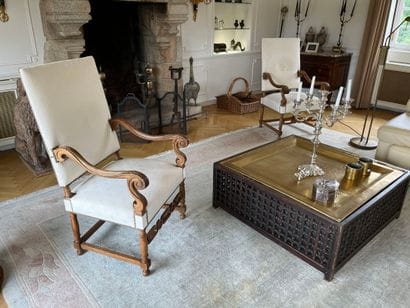 Suite of three molded and carved walnut armchairs,...