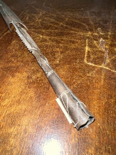 Iron spear point engraved with stylized motifs....