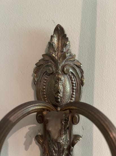Pair of two-light ormolu sconces decorated...