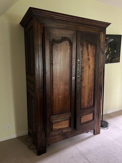 Moulded chestnut cupboard opening to two...