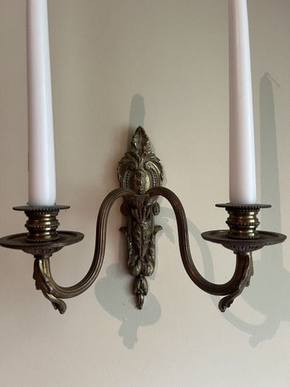 Pair of two-light ormolu sconces decorated...