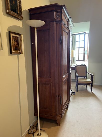 Molded and carved oak armoire. Opens to two...