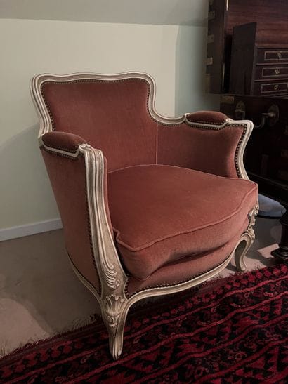 Pair of bergères in molded and carved wood...